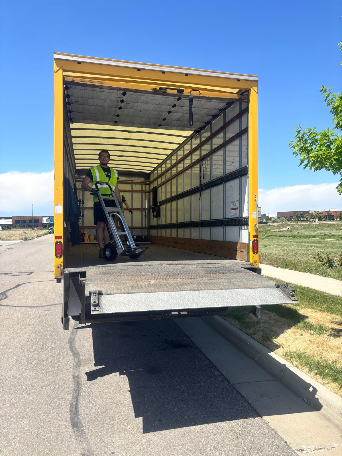 Team member with hand truck